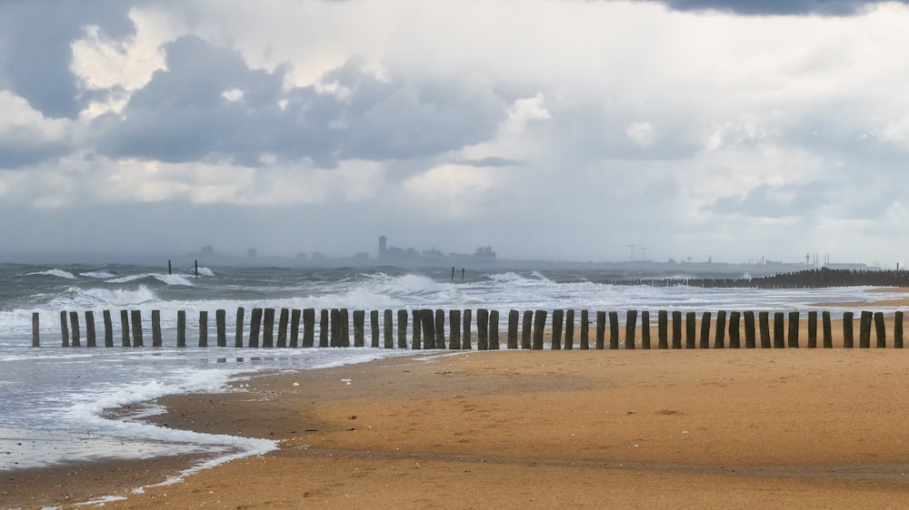 a beach with waves crashing on the shore