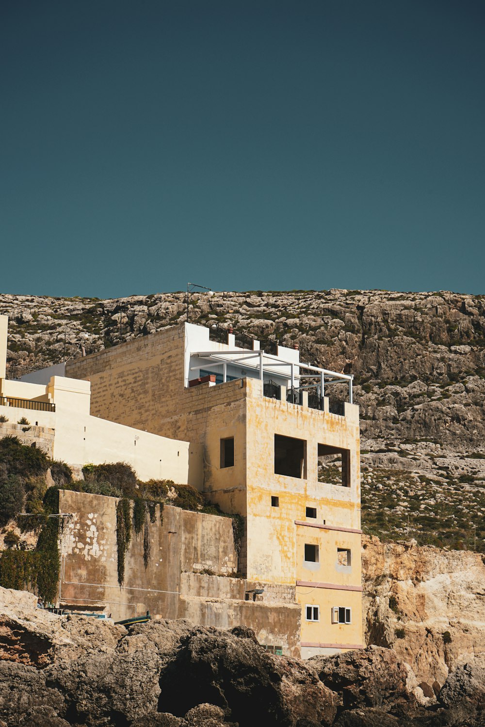 a building on the side of a cliff