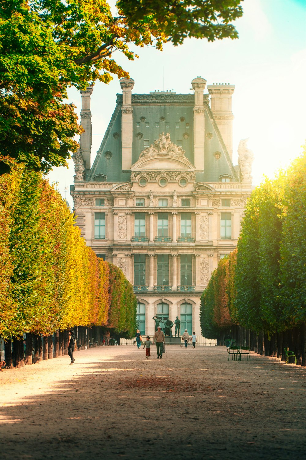 a large building with a lot of trees in front of it