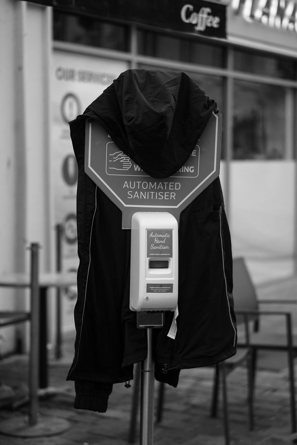 a black and white photo of a parking meter