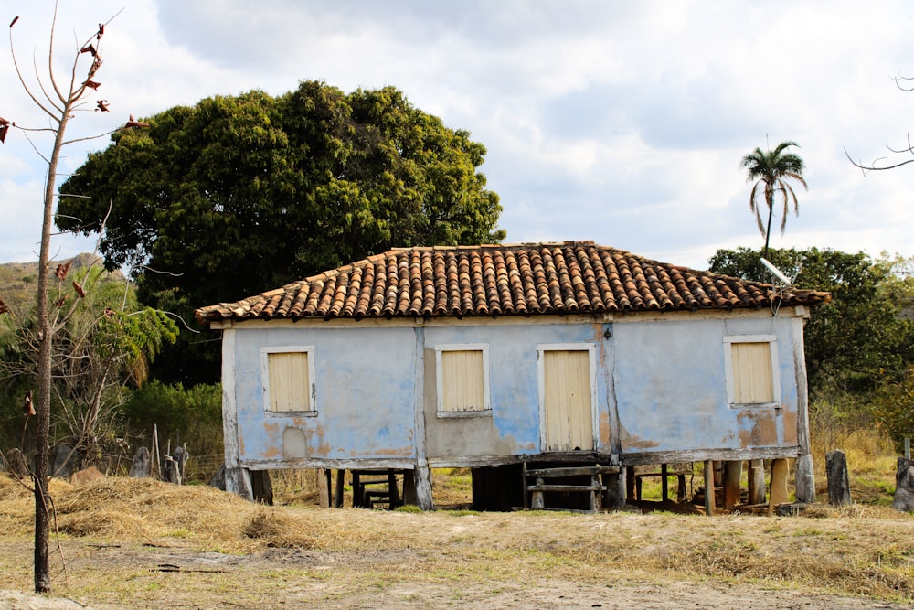 an old run down building with a tiled roof