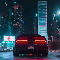 a car parked in a parking lot at night