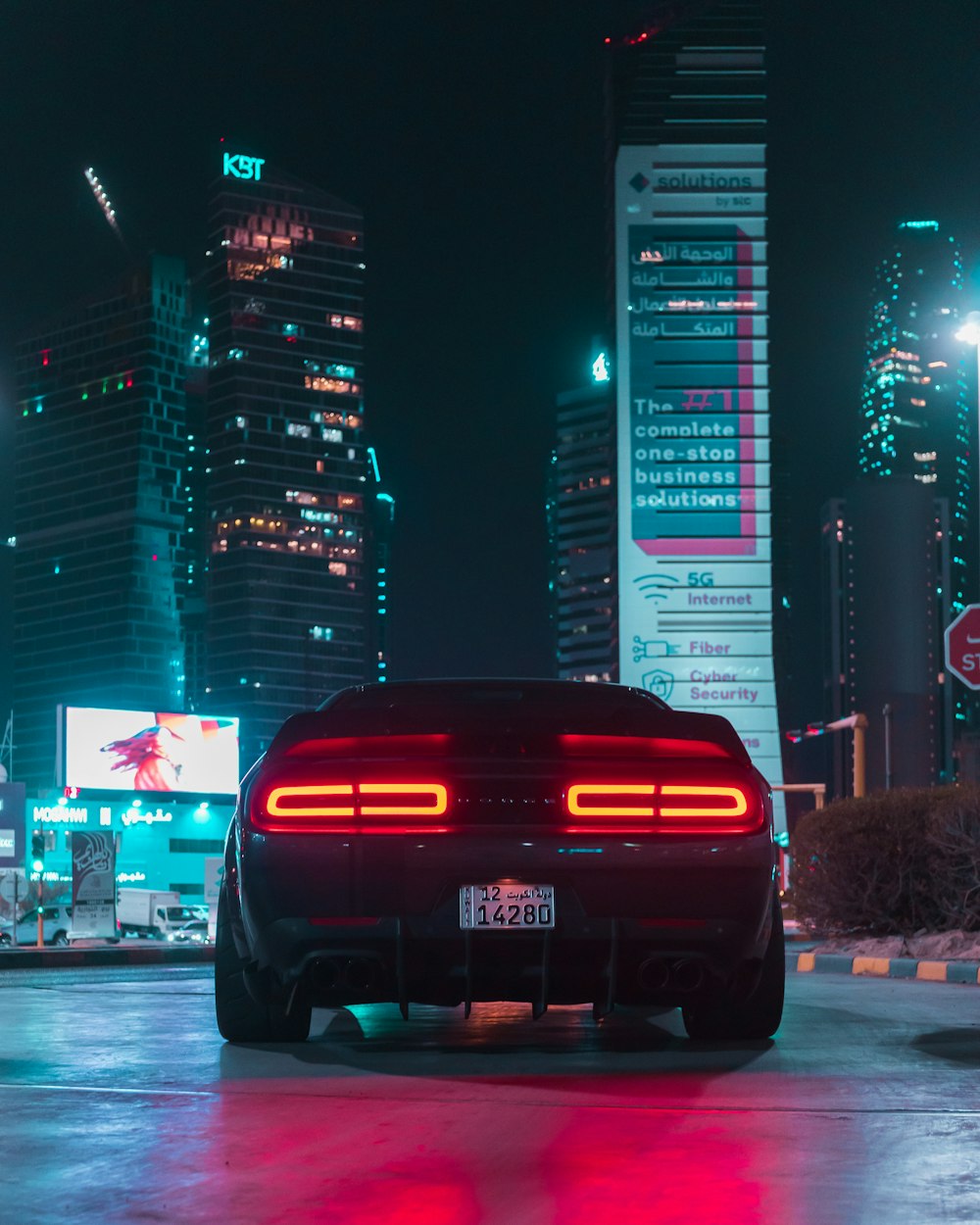 a car parked in a parking lot at night