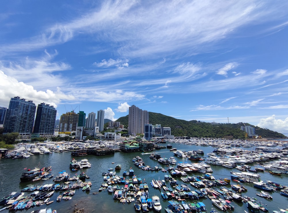 a harbor filled with lots of boats under a blue sky