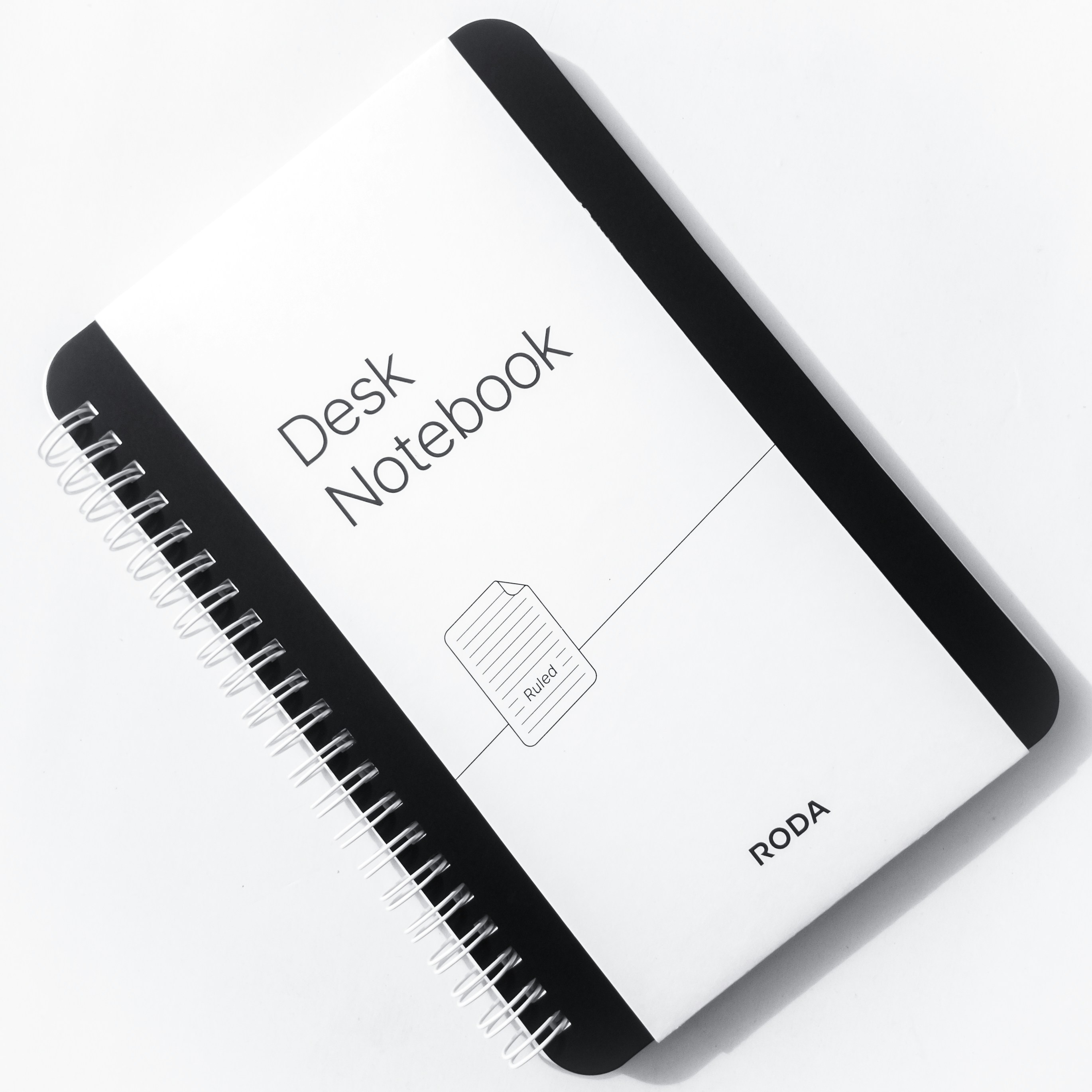 A4 size notebook with ruled pages on office desk