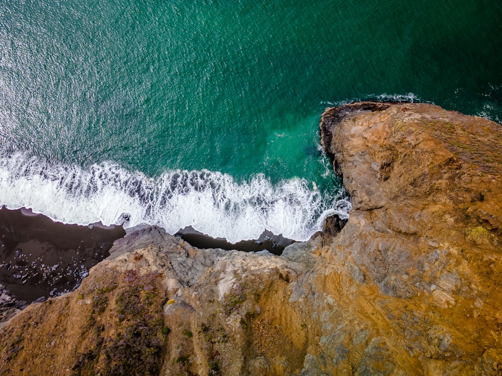 a view of the ocean from above of a cliff