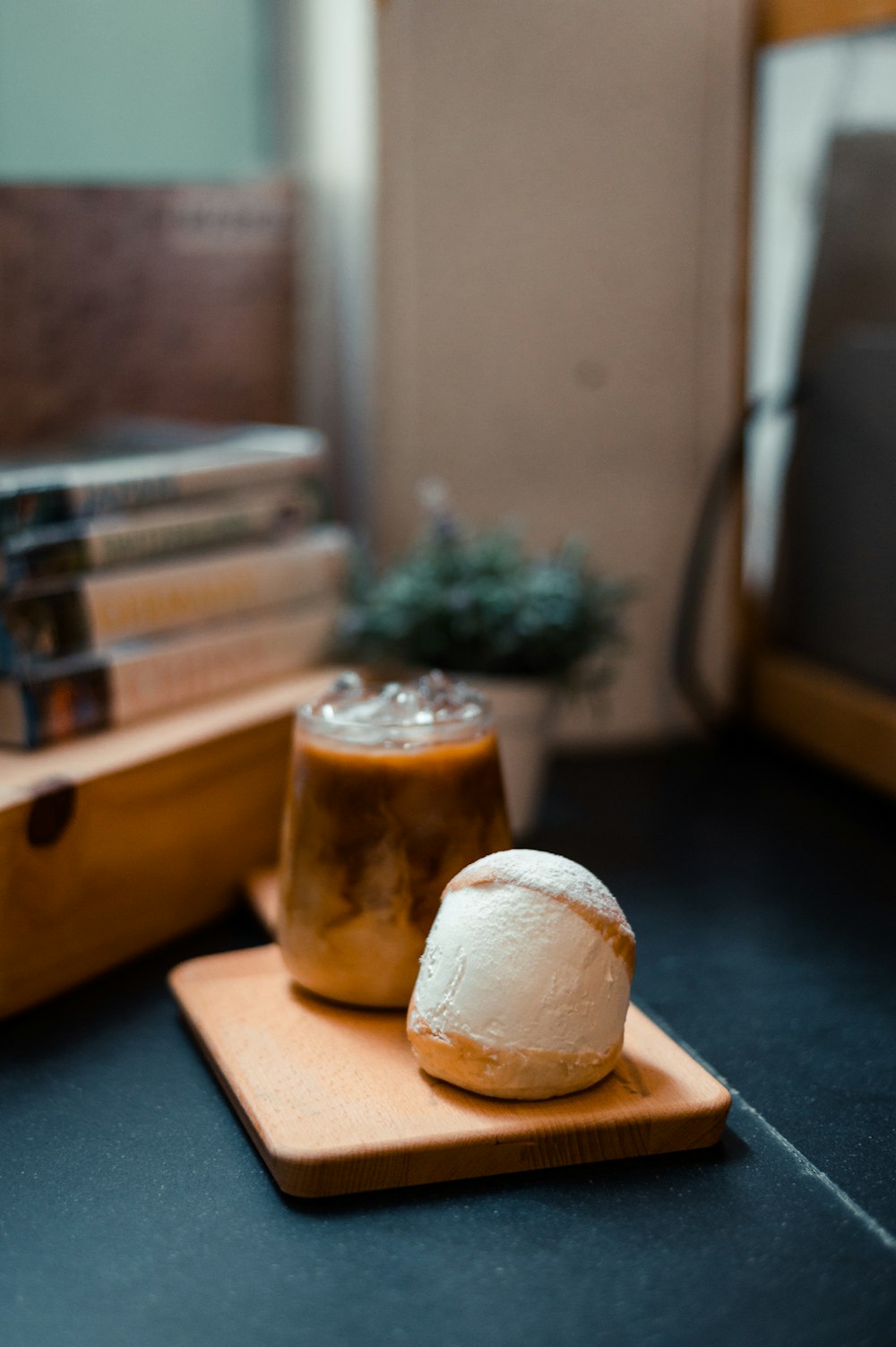 a wooden cutting board topped with a piece of cake