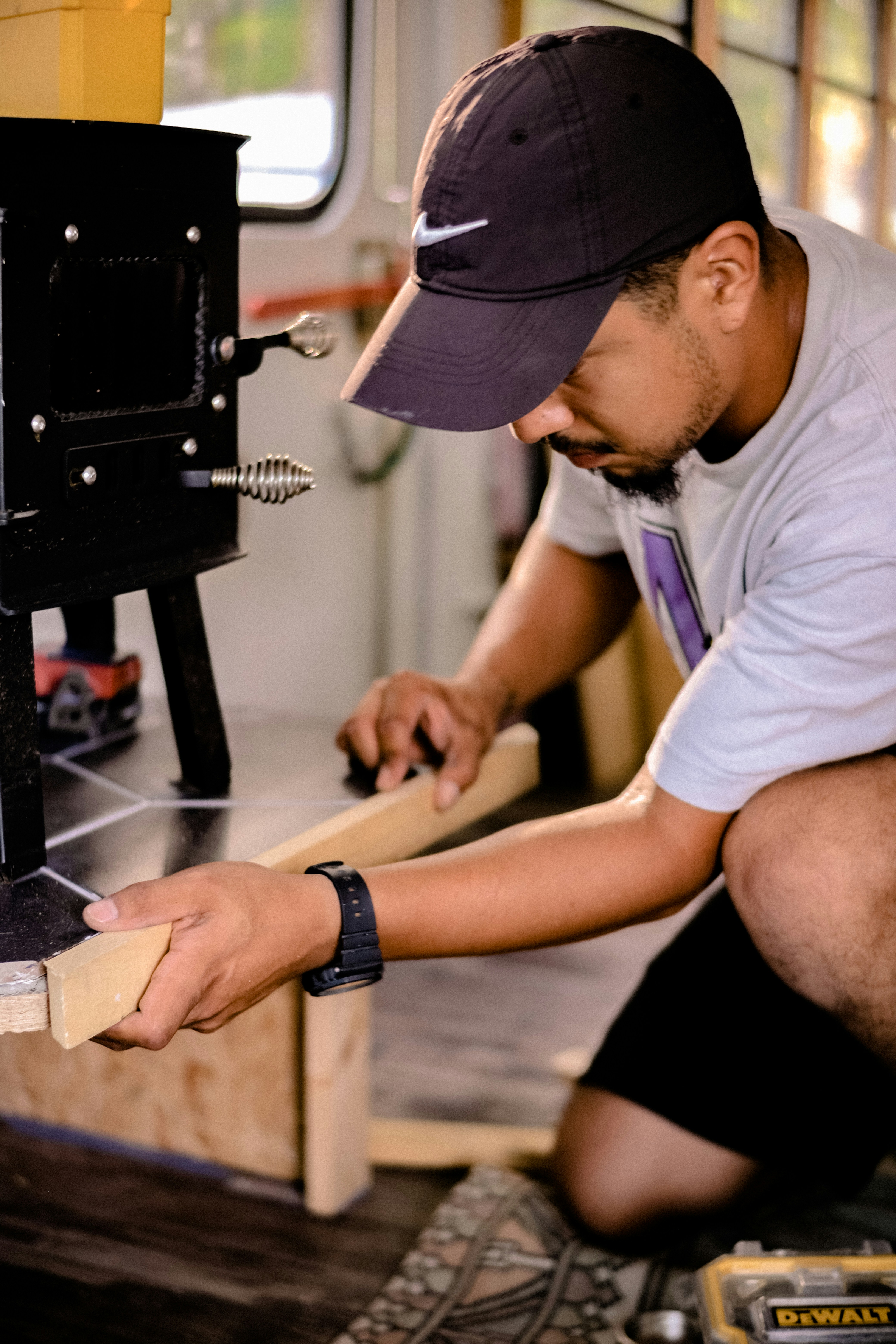 a man working on a piece of wood