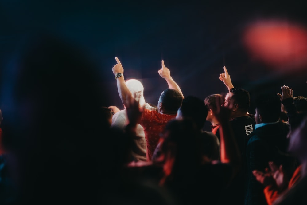 a group of people standing on top of a stage