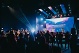 a group of people standing on top of a stage