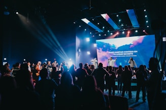 a group of people standing on top of a stage