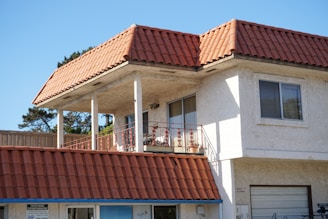 a large white building with a red roof