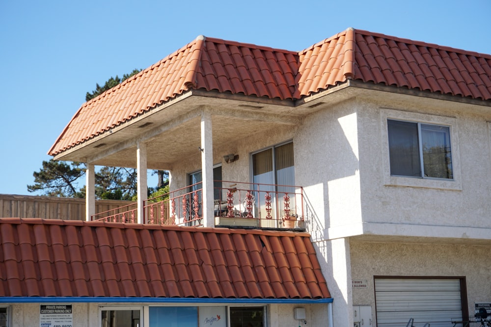 a large white building with a red roof