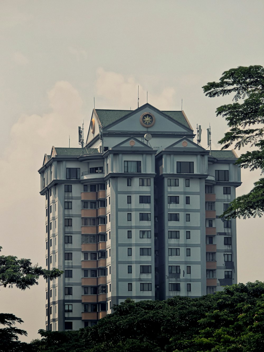 a tall building with a clock on the top of it