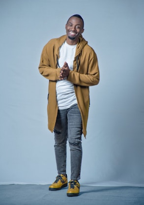 A friendly customer service representative wearing casual sportswear, smiling and ready to assist.