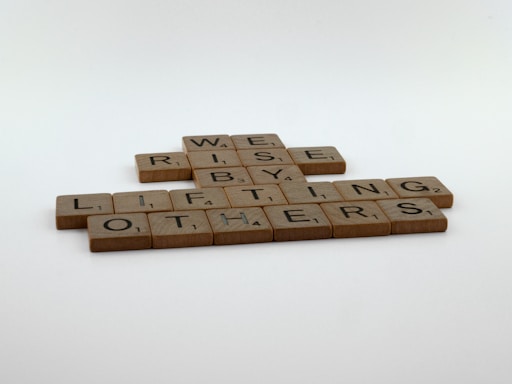 a couple of scrabble tiles sitting on top of a table