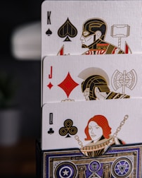 a stack of playing cards sitting on top of a table