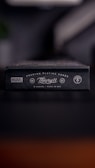 A close-up of a black box that features branding for Marvel and Theory11. The box is labeled as premium playing cards, made in the USA. It has a sleek and minimalist design with white text and logos against a dark background.