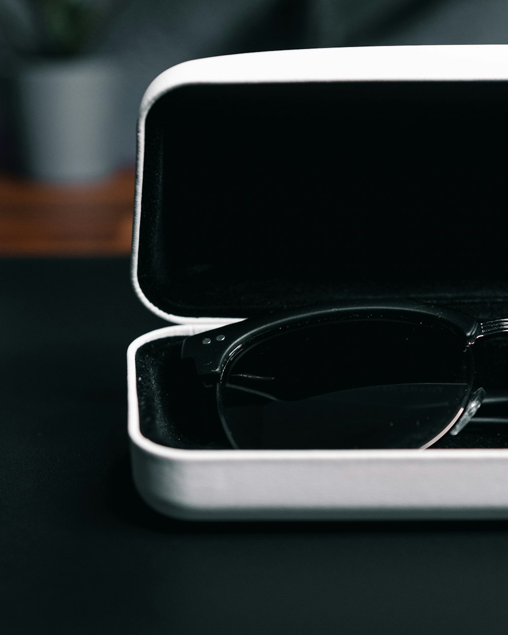 a pair of glasses sitting inside of a white case