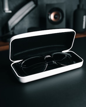 a pair of glasses in a case on a table