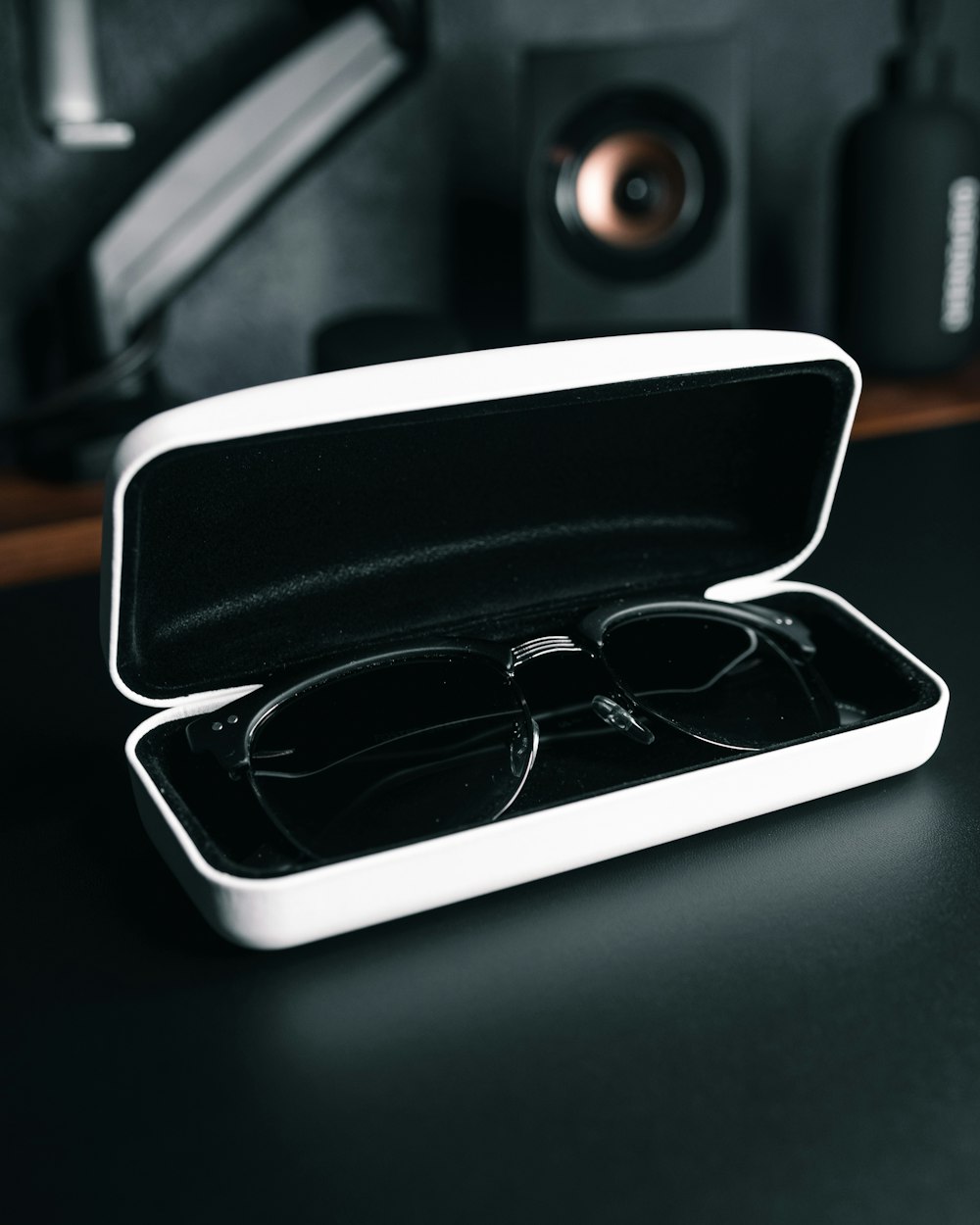 a pair of glasses in a case on a table