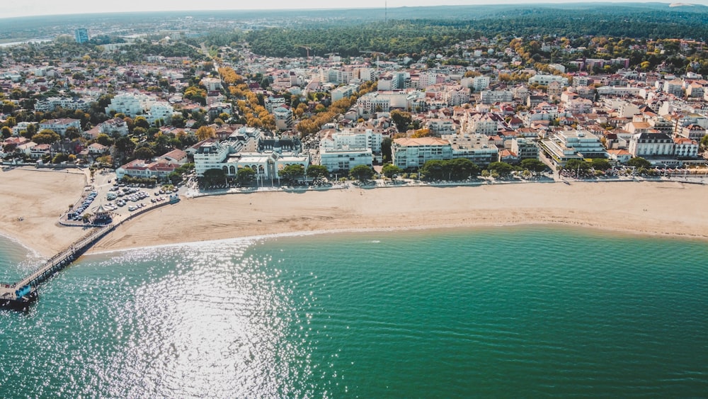 an aerial view of a beach and a city