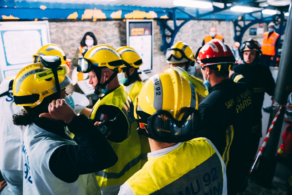 a group of firemen standing next to each other