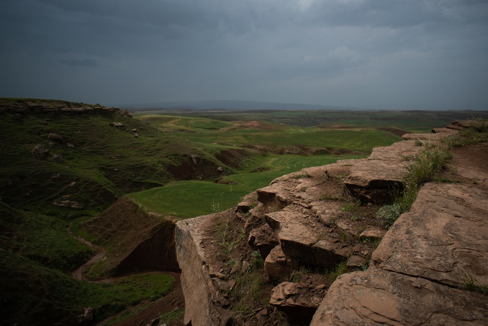 a view of a rocky outcropping on a cloudy day