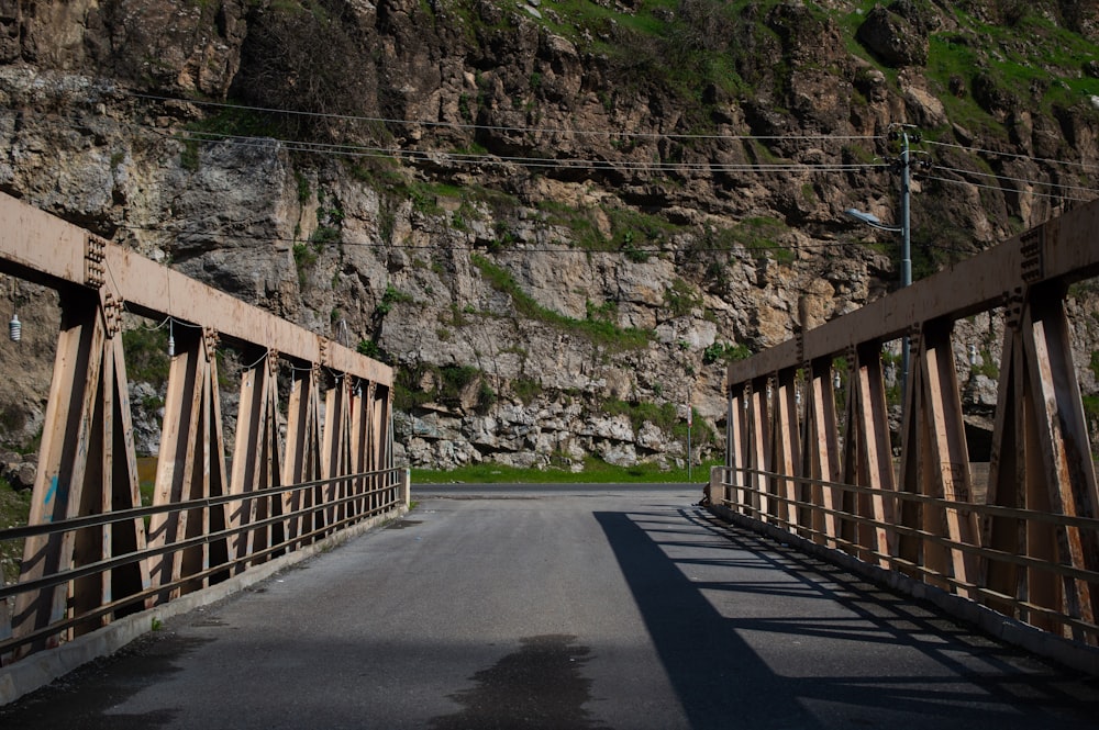 a bridge with a mountain in the background