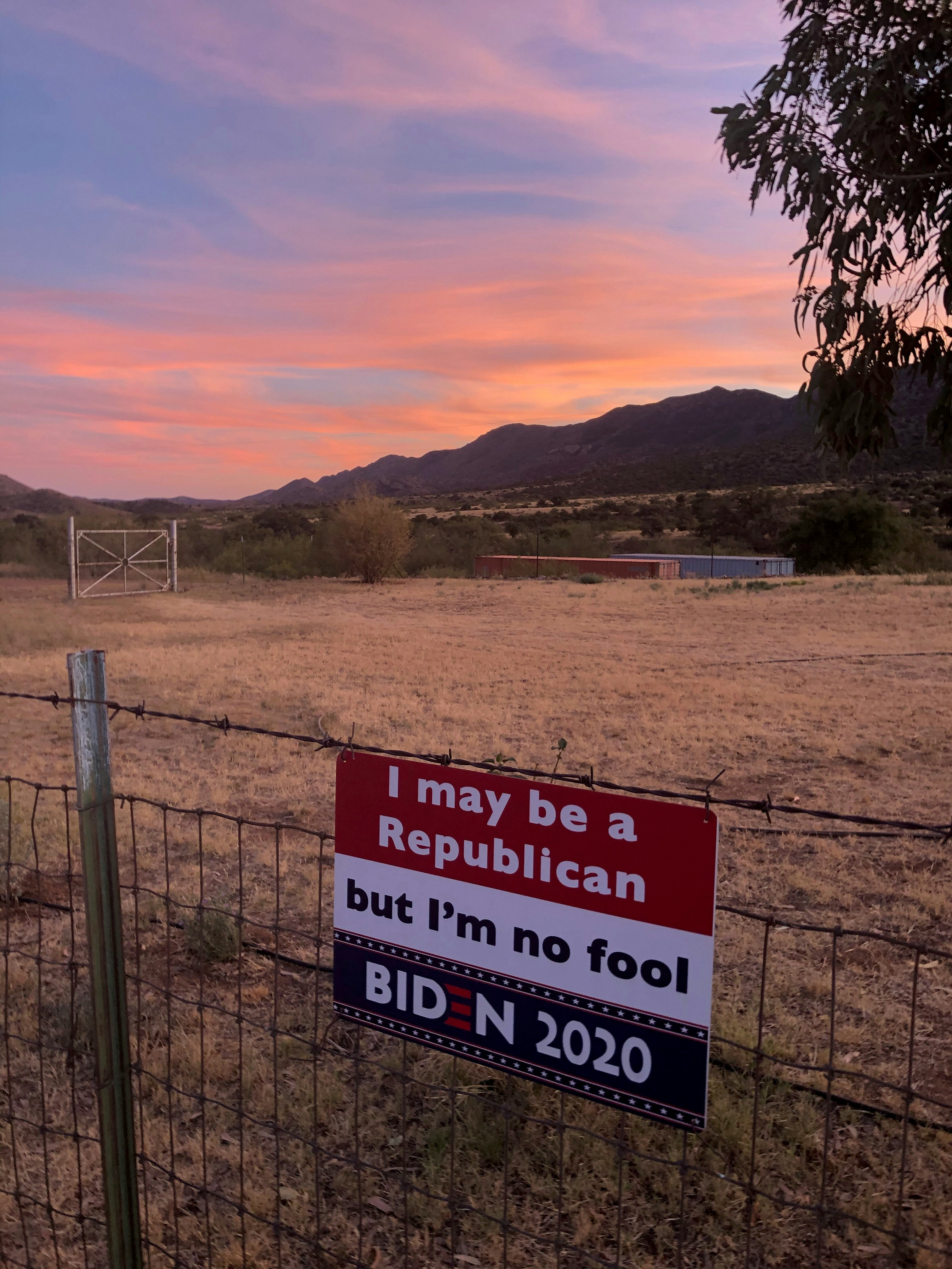 a sign on a fence that says i may be a republican but i'm
