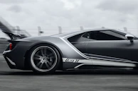 A high-speed racing car zooming past, showcasing cutting-edge aerodynamics in motion.