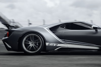 A sleek modern sports car on a racetrack.