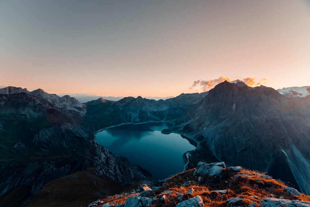 a view of a mountain range with a lake in the middle