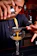 Close-up of the patented bartending tool in use, pouring a cocktail with precision.