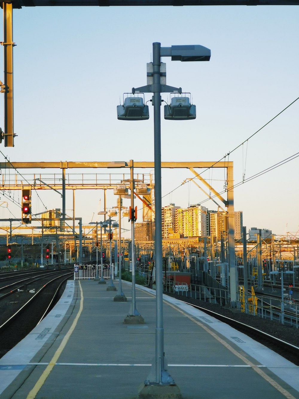 a train station with a train on the tracks