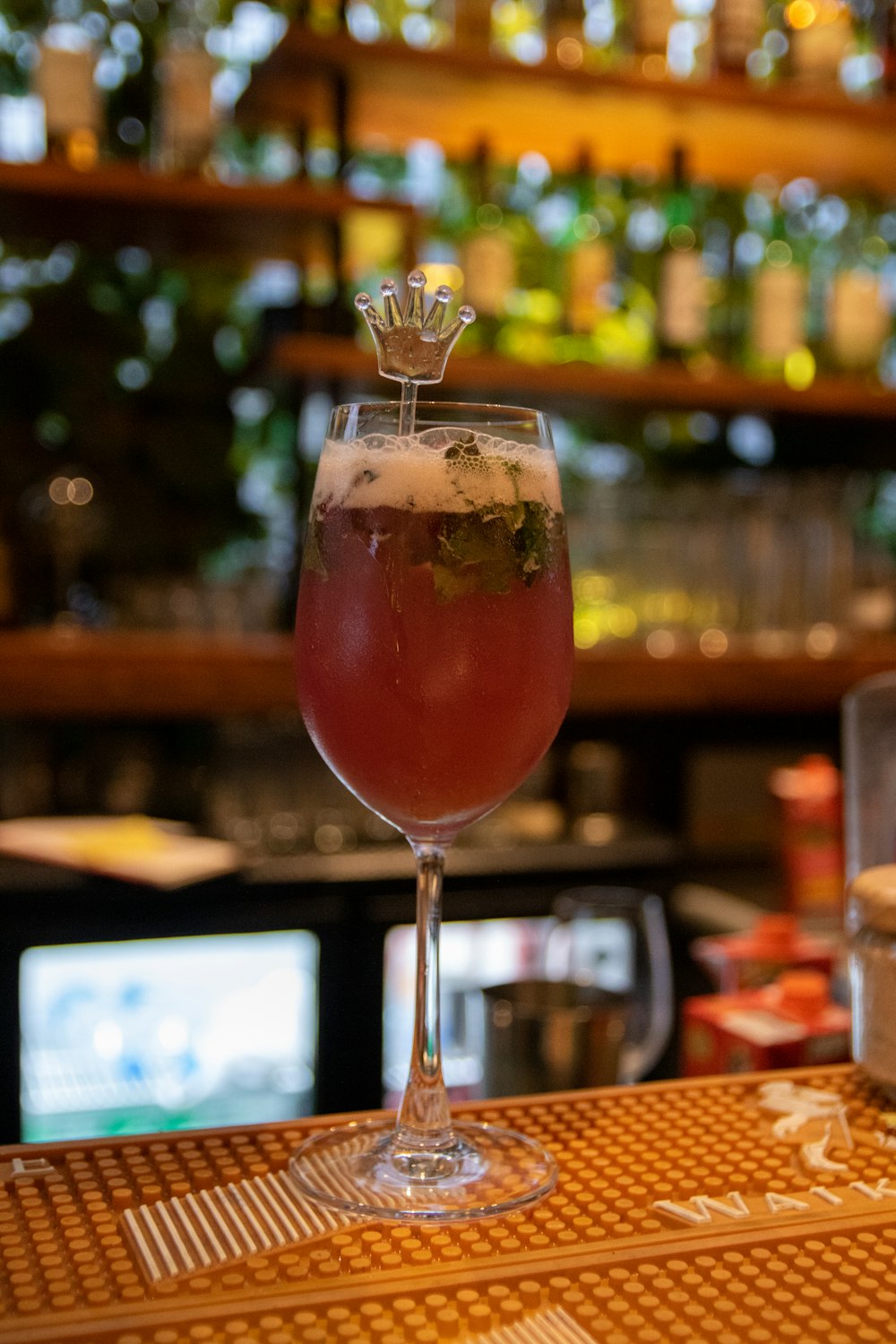 a close up of a wine glass on a table