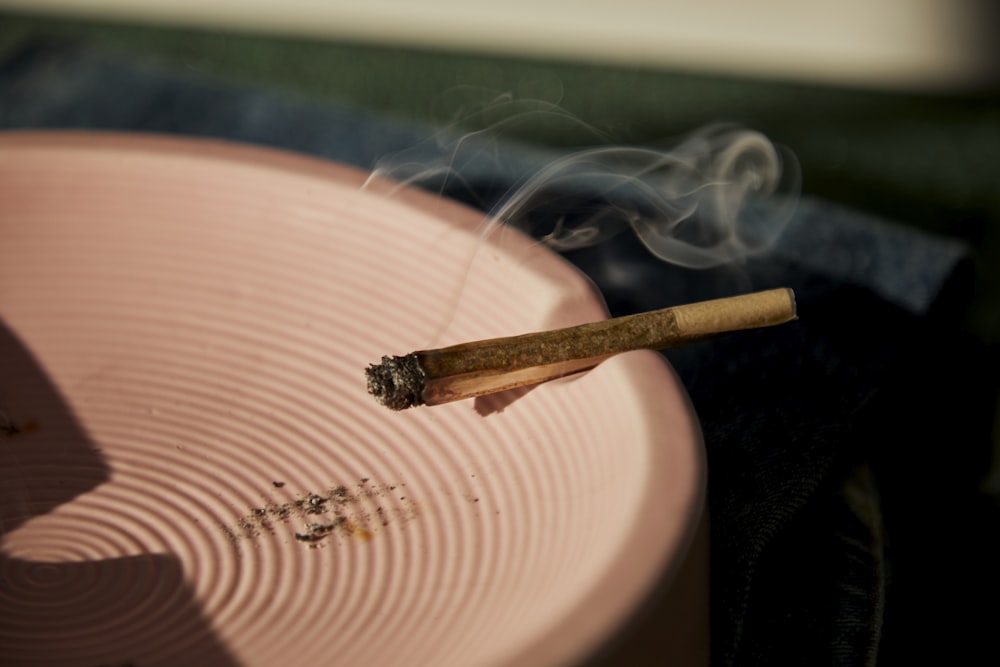 a close up of a cigarette on a plate