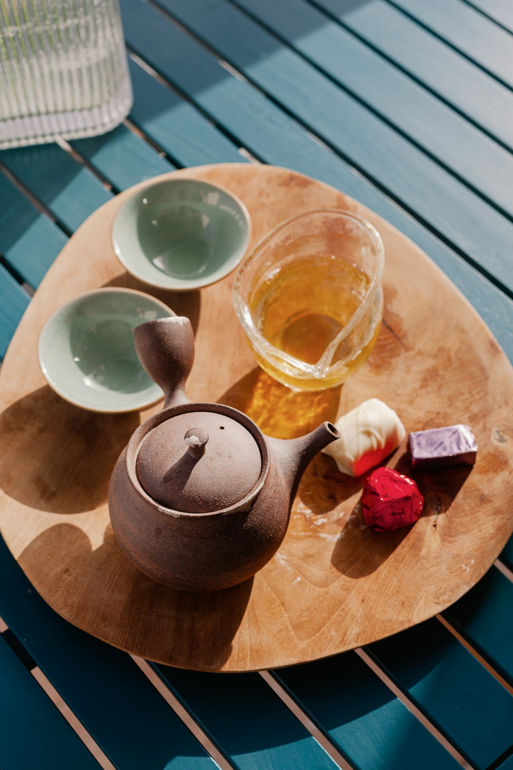 a tea set on a wooden tray on a table