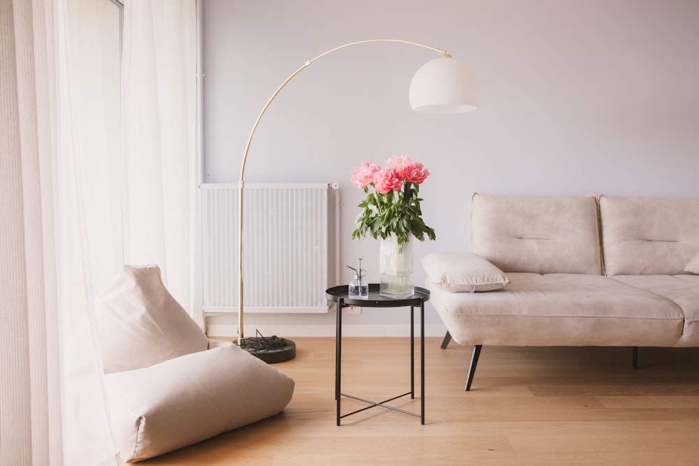 a living room with a couch, chair and a table