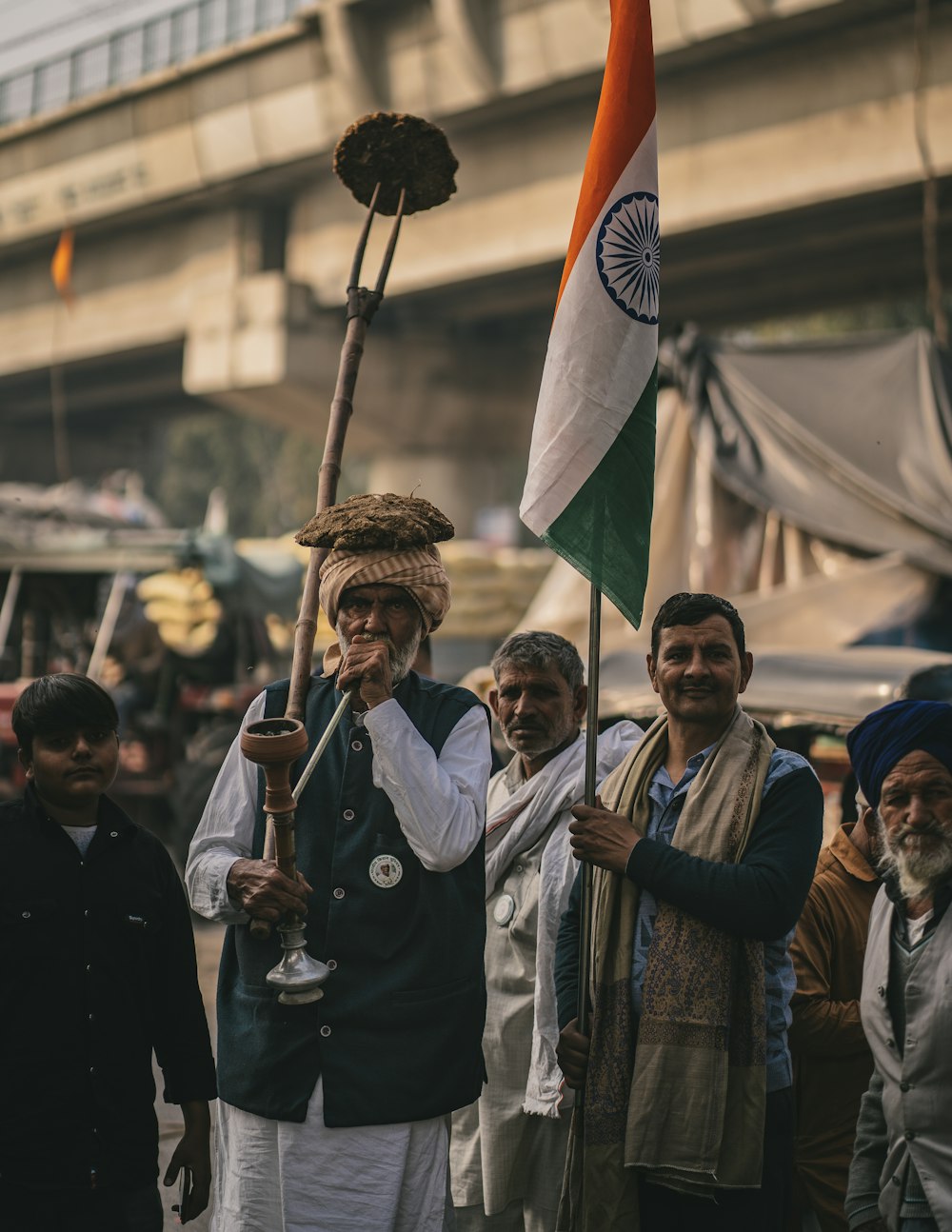 a group of men standing next to each other holding flags