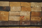 Stack of polished wooden planks ready for furniture making.