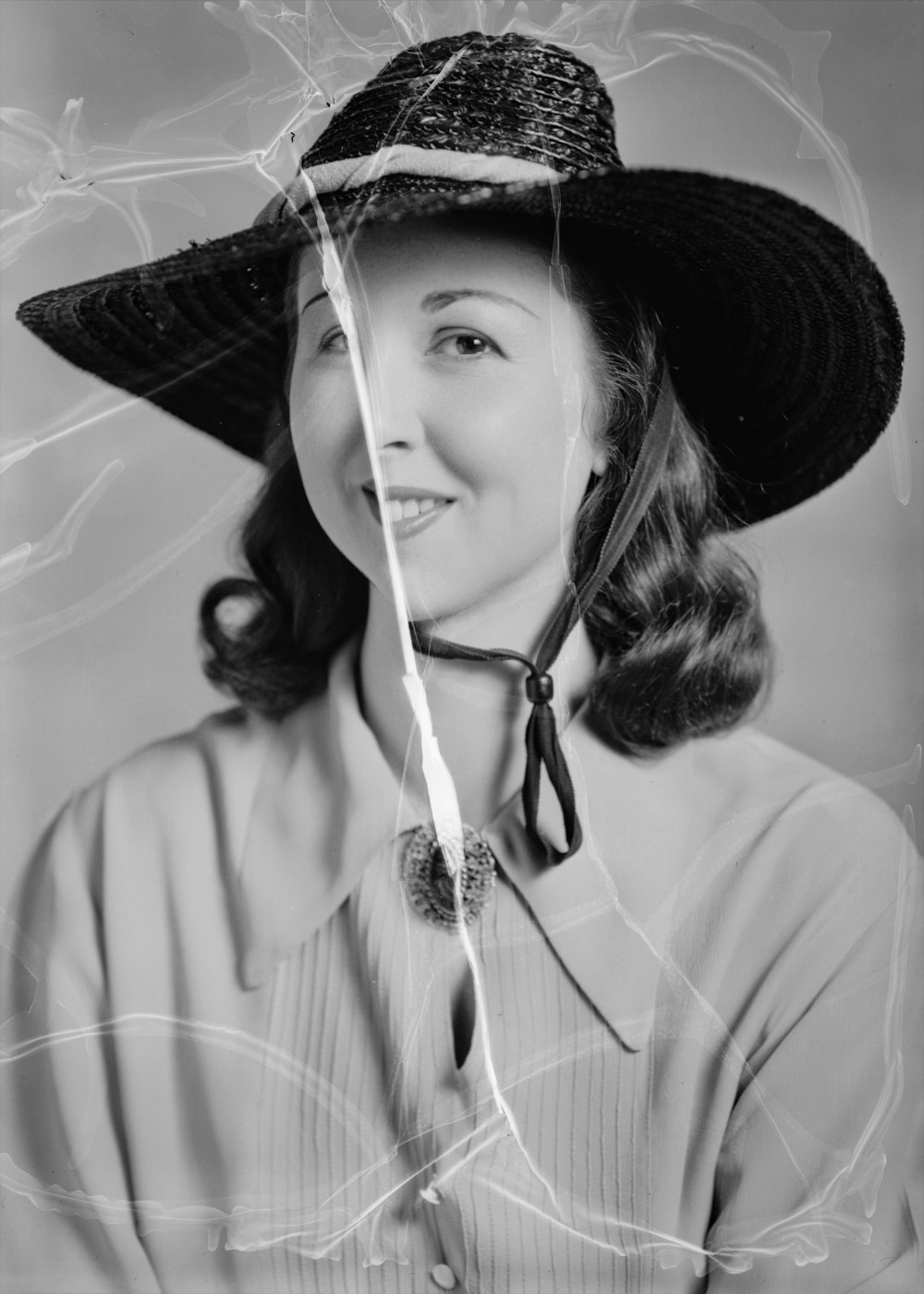 a woman wearing a hat and a tie
