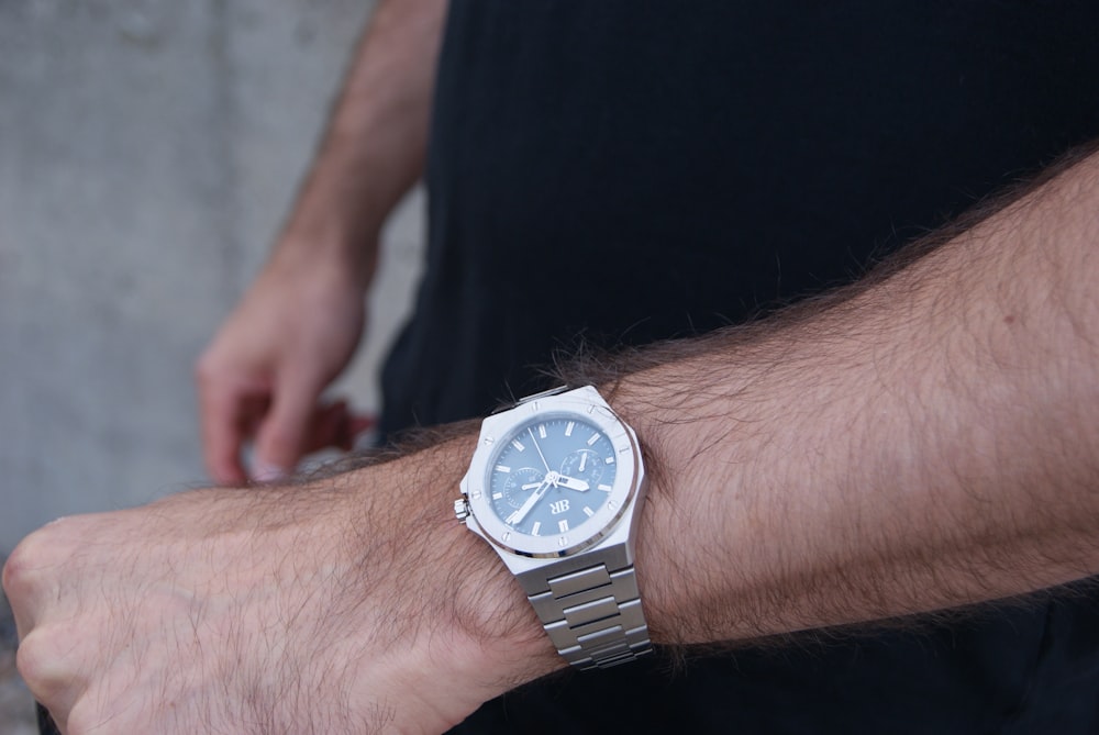 a close up of a person wearing a watch