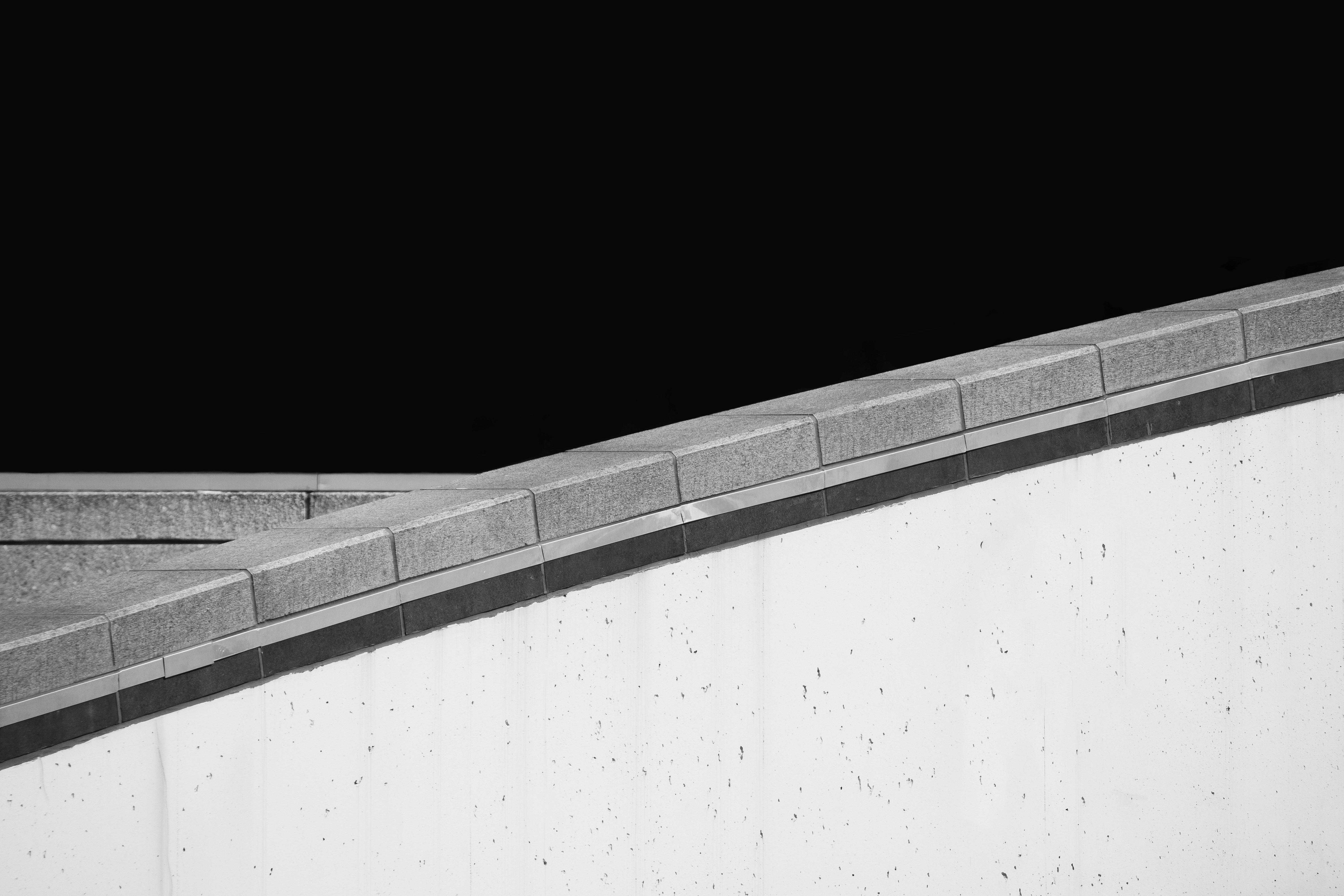 a man riding a skateboard up the side of a ramp