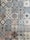 A collection of intricately designed ceramic tiles with various geometric and floral patterns. Each tile features unique motifs with combinations of blue, beige, and terracotta colors. The patterns range from symmetrical star shapes to more organic floral designs, providing a vintage and artistic appearance.