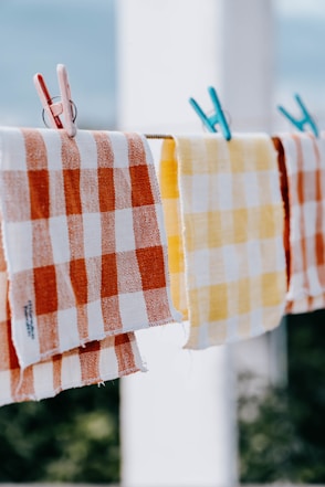 a couple of towels hanging on a clothes line