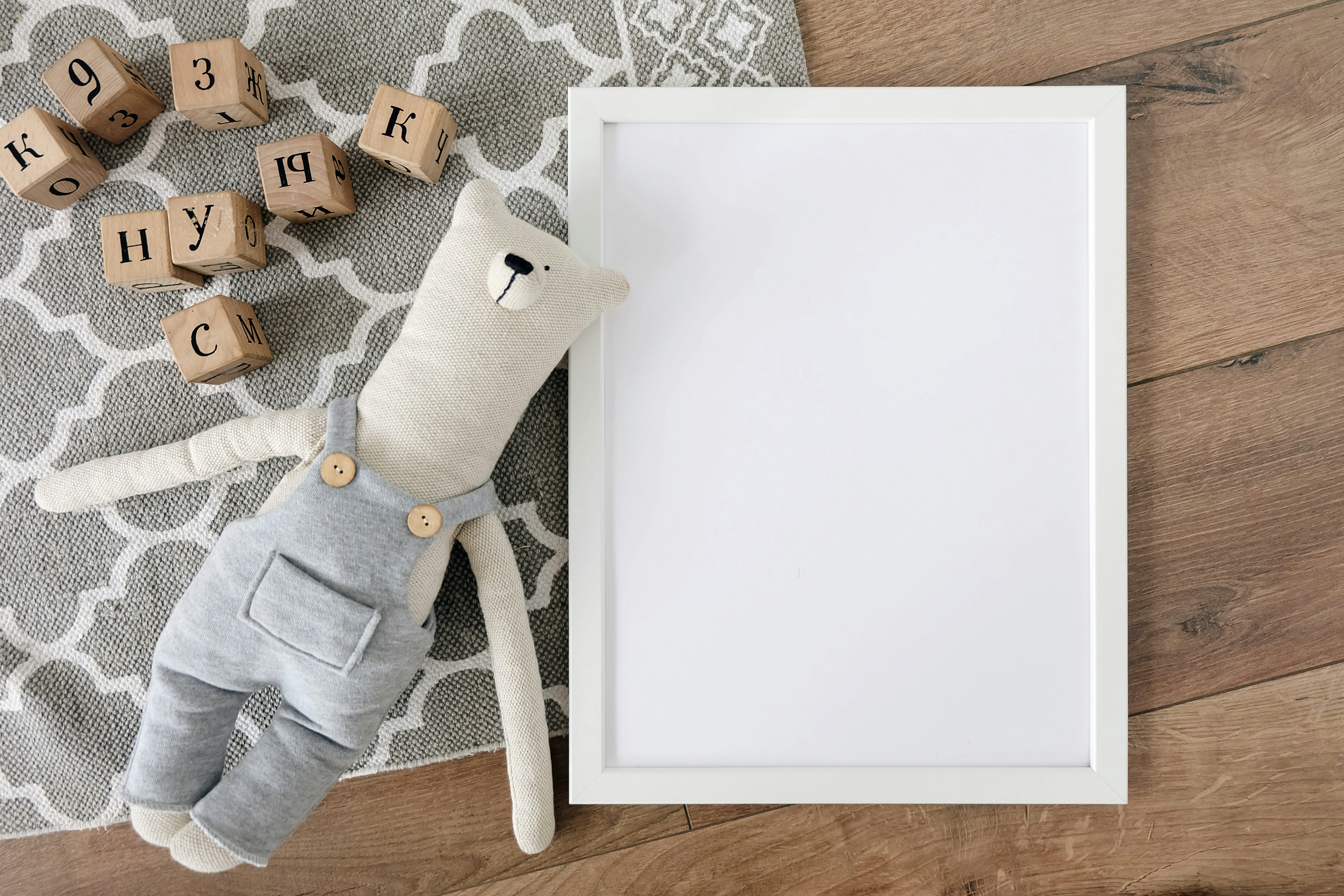 a stuffed animal is next to a framed picture