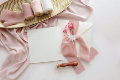 a table topped with pink and white items