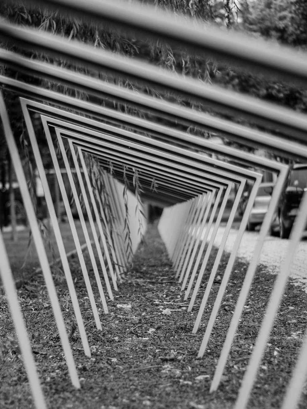a black and white photo of a row of umbrellas
