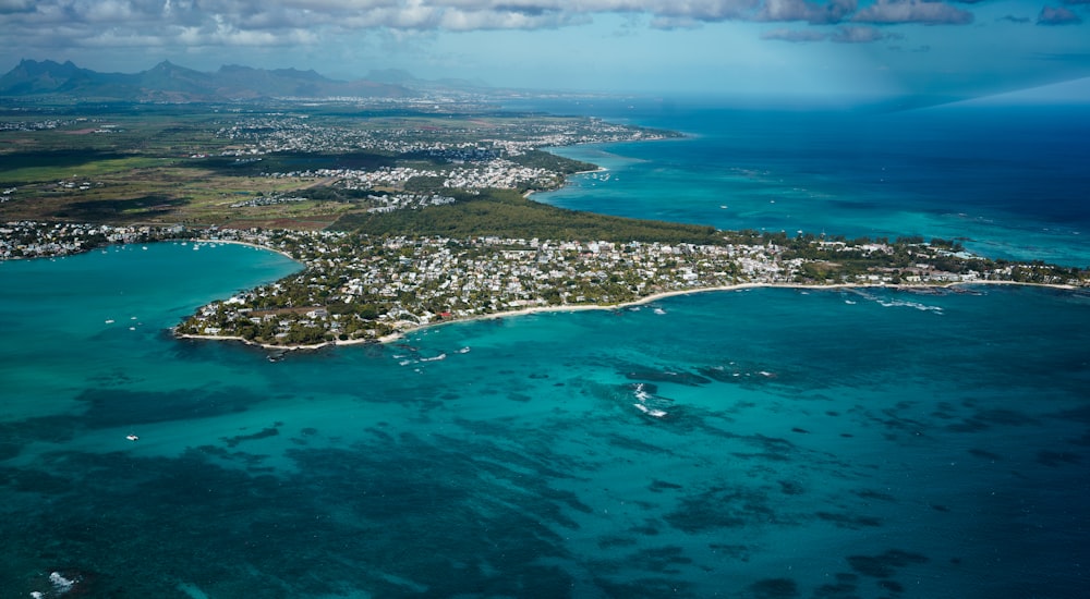 an aerial view of an island in the middle of the ocean